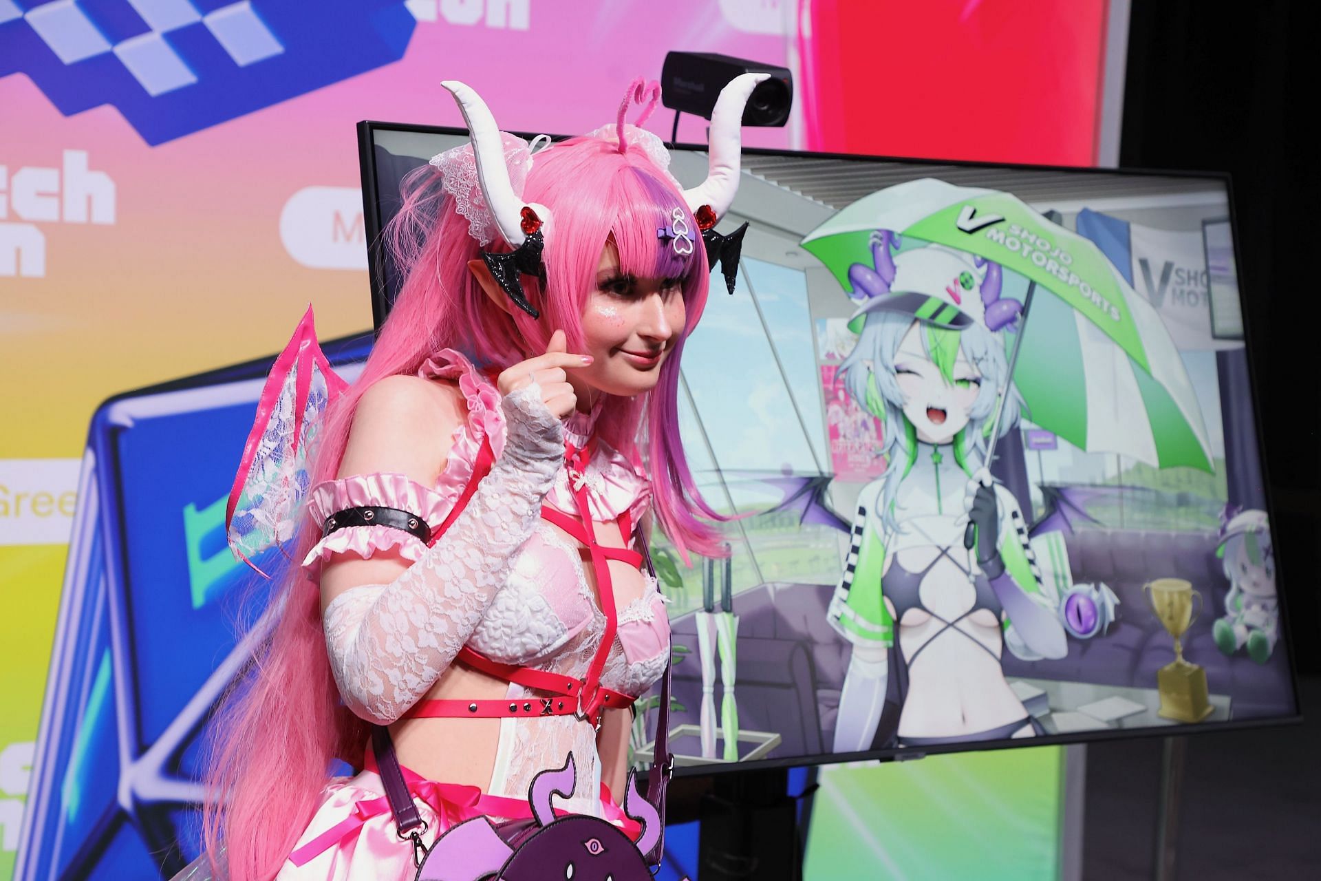 A fan poses with VTuber Ironmouse at TwitchCon 2024 (Image via Getty)